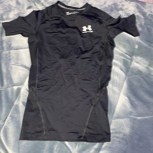 The brand of this t-shirt is under amor and is size small in men’s